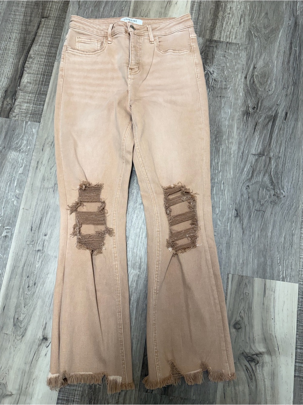 High-Rise Frayed Flare Jeans in Blush by Unknown Brand